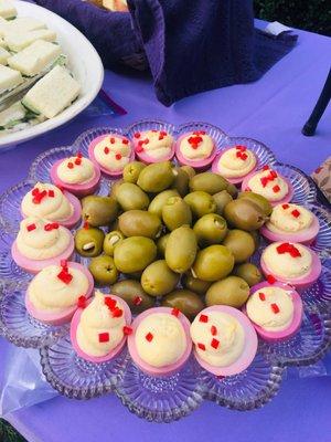 Beet stained truffled eggs and garlic & jalapeño stuffed olives.