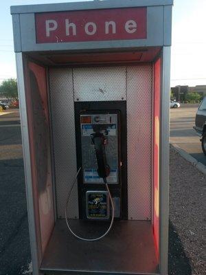 Old fashioned pay phone just past the east end of the store 25 cents