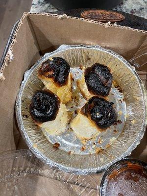 A failed attempt at garlic knots, sold upside down to hide the charred tops.