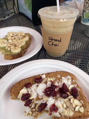 Iced chai latte Almond butter toast with cranberries, coconut flakes, and almonds  Pistachio butter toast with bananas and almonds