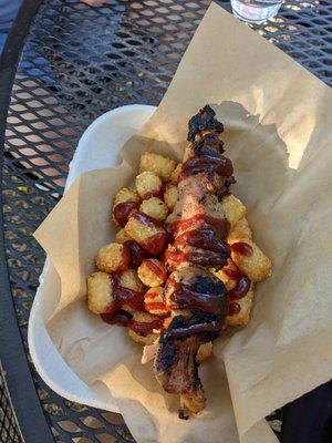 Chicken skewers on tots $14