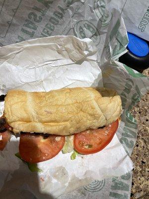 Sloppy squished sub. The bread is so screwed up the tomatoes don't even fit on it.