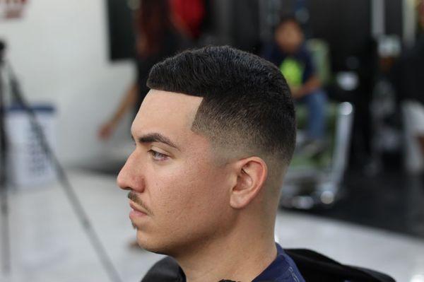 A low bald fade with hair fiber for picture enhancement