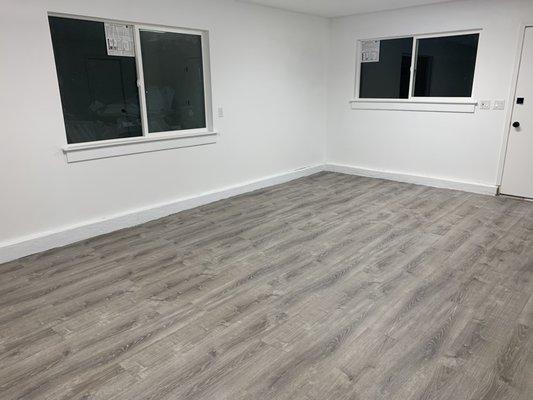 Garage conversion brilliance. Premium vinyl plank flooring, updated windows, lighting, & sleek matte black fixtures. Transformed with style.