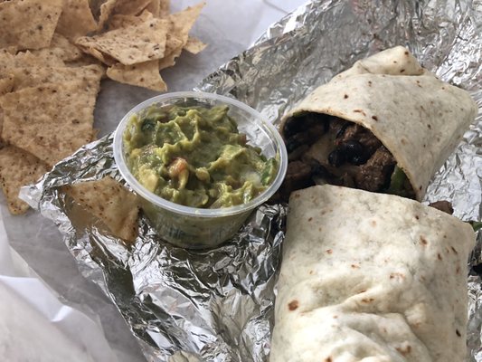 A generous serving of guacamole to set off the steak burrito!