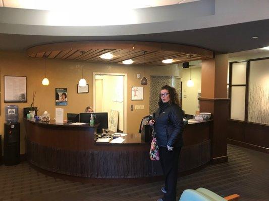 Happy staff at front desk