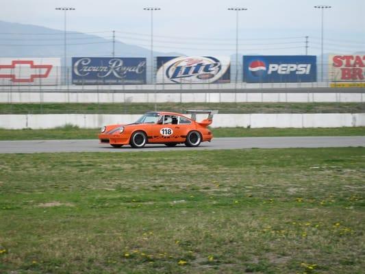 1974 Porsche 911 at speed, California Speedway.