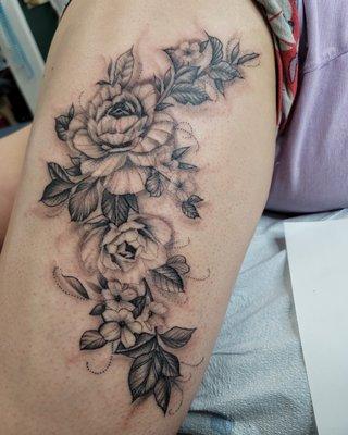 Black and grey floral tattoo