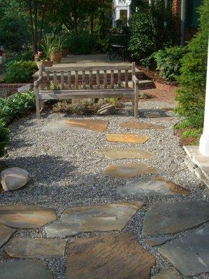 Pea gravel and embedded flagstone terrace