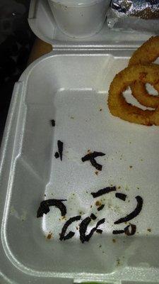 Not sure what this is that was under my onion rings. I ate the sandwich and slaw since they were separated, not this!