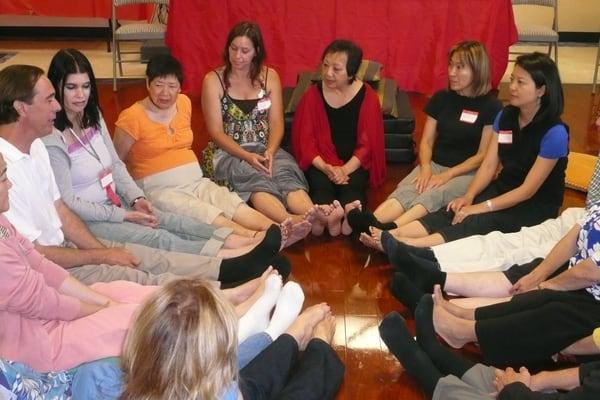 Dr. Effie Chow in a mediation circle with students.