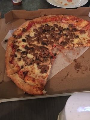 Large two topping pizza with sausage and mushrooms