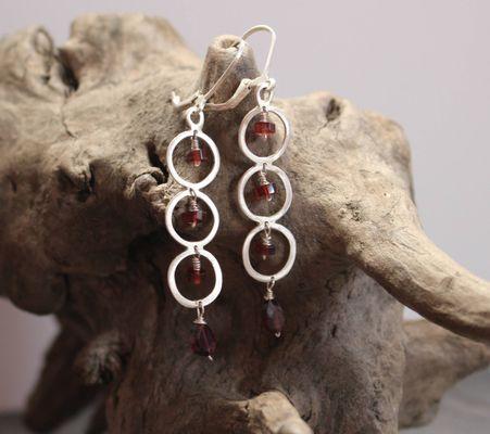 Garnet and sterling silver drop earrings.