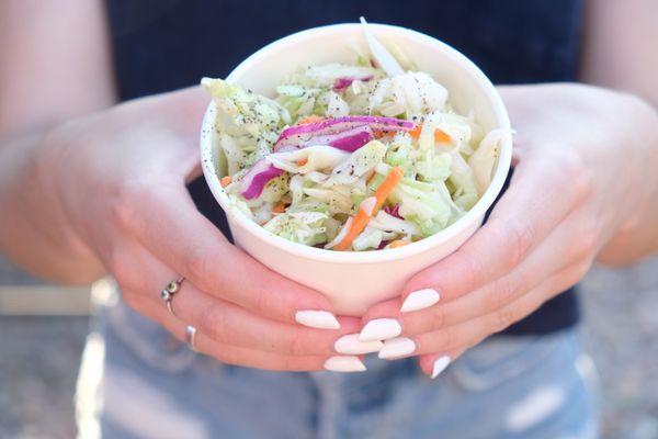 Our homemade vinaigrette coleslaw. We also offer creamy style coleslaw.