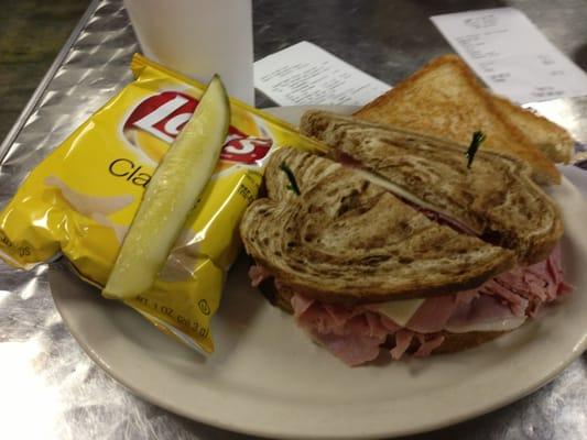 Not quite a 8 dollar meal including Coke.  Meat looks like it came out of a plastic bag from the freezer deli section.