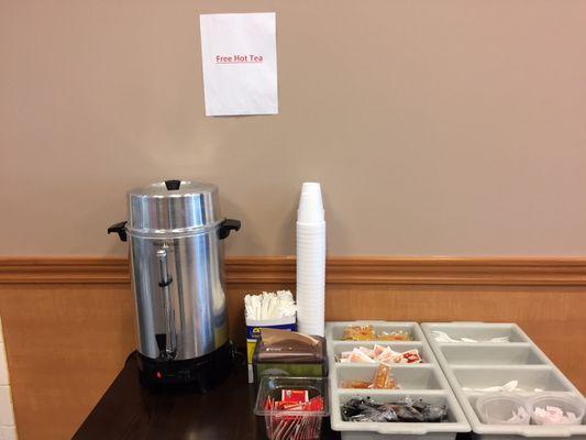 Area for condiments (hot/duck/soy sauce, mustard, ketchup), utensils (forks/knives/spoons), and black oolong tea (free)! (11/12/2017)