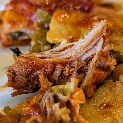 Close-up of carne adovada in breakfast enchiladas