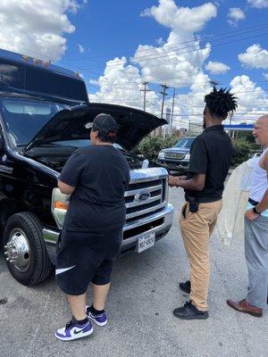 The auto zone workers helping us out plus the license plate of the party bus in Texas.