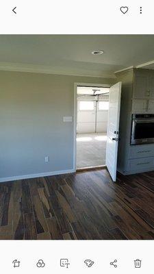 New construction, primed and painted walls, ceiling, trim, and doors