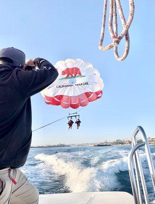 my son enjoying the PARASAILING