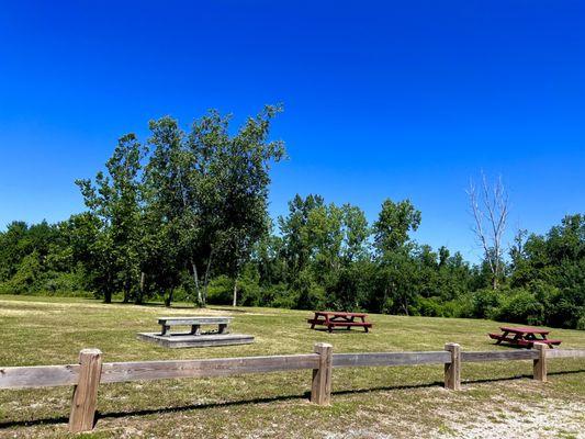 Picnic tables next to parking lot