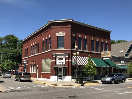 The library is located upstairs on the corner of Spring and Main.