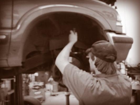 One of our mechanics checking out a vehicle.