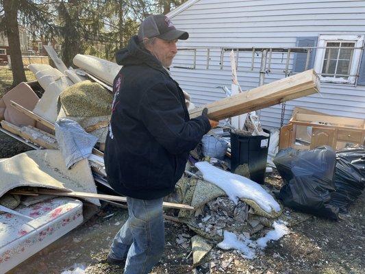 Junk Removal from behind a garage St. Joseph, MI.