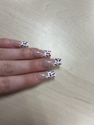 it's supposed to be leopard print...they did good shaped,was very nice, the french tip part was done very well print it looks more like dots