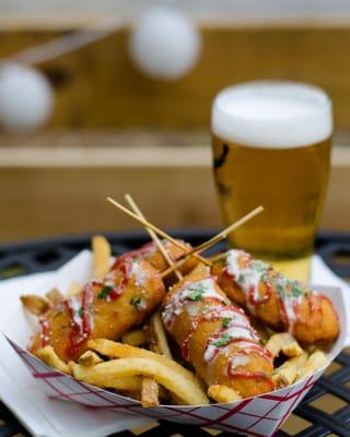 Hand Battered all beef corndogs with ranch, ketchup and Cotija cheese over house cut Fries