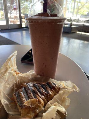 Pizza croissant and banana strawberry smoothie.