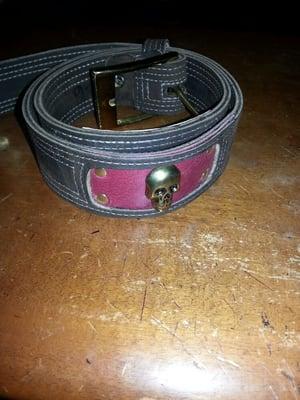 Custom brown and pink with brass skull and hardware....size 30.... $100...