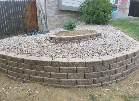 This retaining wall we did for a customer looks amazing. Now she put all types of flowers and various plants in it.