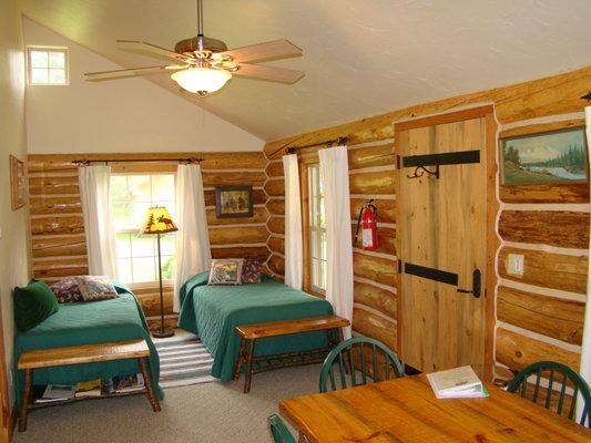 The front room with 2 twin beds and kitchen area.