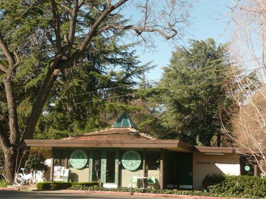 old style architecture with mid century modern chairs