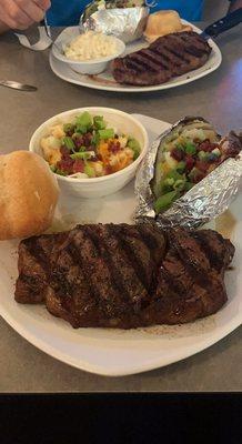 Ribeye , loaded baked potatoes and loaded Mac n cheese. Yummy!