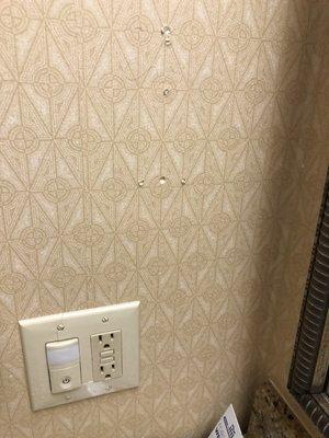 Holes in the wall, cracked outlet cover