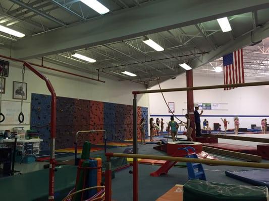 Class check in far left, rock climbing wall as a little one reward, bars and rings for the little ones immediately in front