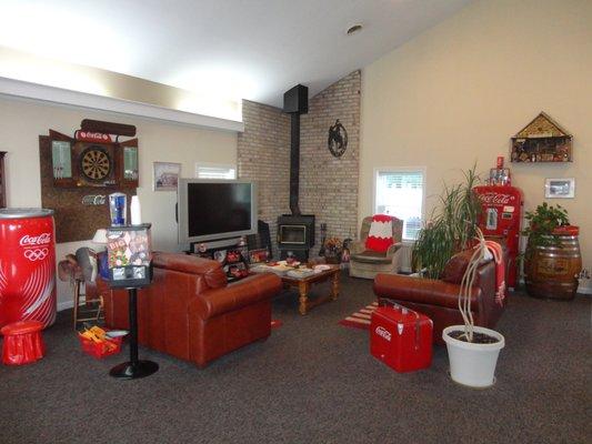 Relax by the charming wood stove while you have a short wait for your barber