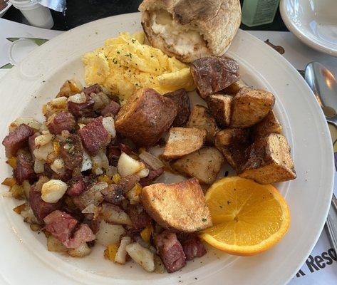 Corned beef hash, scrambled eggs, home fries and English muffin