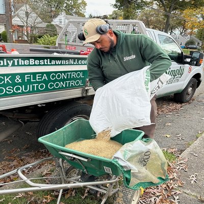 Professional getting ready to perform an overseeding service.