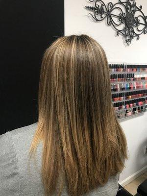 Women's highlight on brunette hair with haircut and style