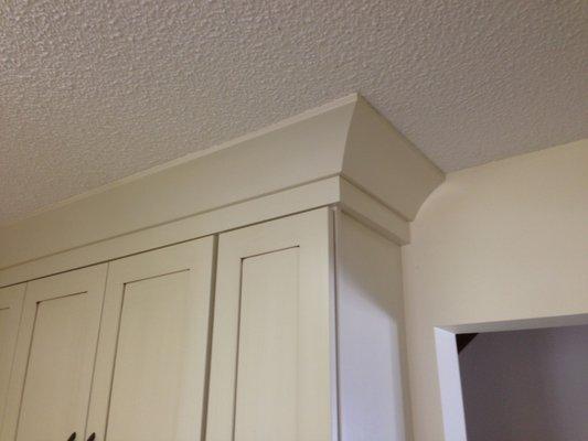 Crown moulding added to cabinets- Cove crown moulding