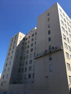 K&H performing concrete repair, silicone sealant installation, and silicone elastomeric coating application downtown Oakland