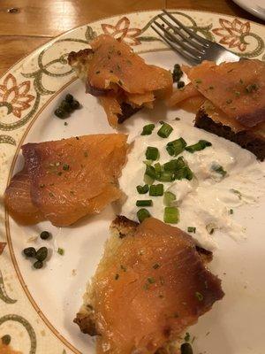 Smoked salmon on a slice of toasted Italian bread with cream cheese and chives. Very tasty!