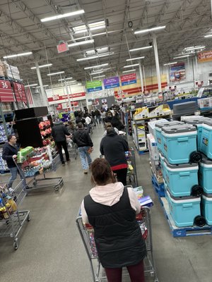 Checkout line going halfway back through the store.