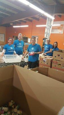 Our team volunteering at a local food bank.