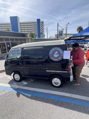 A 1995 Subaru Sambar with an espresso machine in the back!