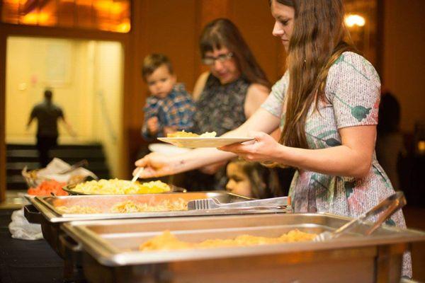 Our photographer didn't get many pictures of the food itself but snapped these 2 of people serving themselves.