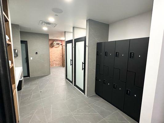 Locker room with showers and steam baths available.